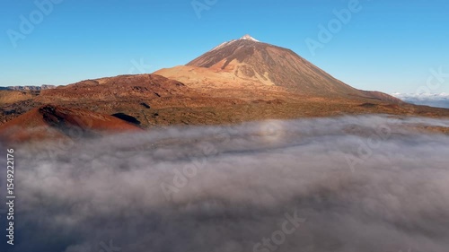 Experience the Breathtaking and AweInspiring View of a Majestic Volcano Rising Above the Clouds. Teide