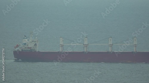 Ship Crew Foggy Sea Workers on a ship in foggy seas, likely pulling a line or rope.