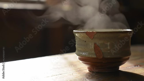 Steam Rising from Handmade Teacup in Morning Light