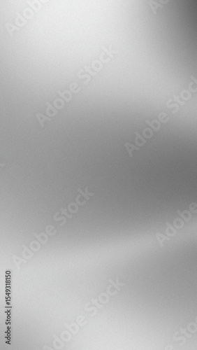 Abstract silver gradient background with subtle light variations and grainy texture creating a metallic appearance