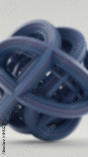 Blurred view of an abstract geometric form composed of interconnected blue tubes against a soft white background