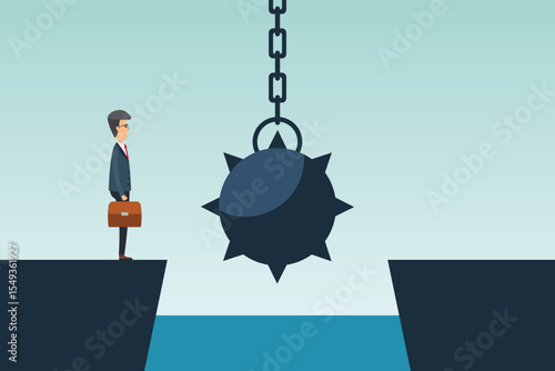 A businessman with a briefcase stands at the edge of a cliff. Dangling between him and the other side is a large, spiked wrecking ball, over water, symbolizing risks. 