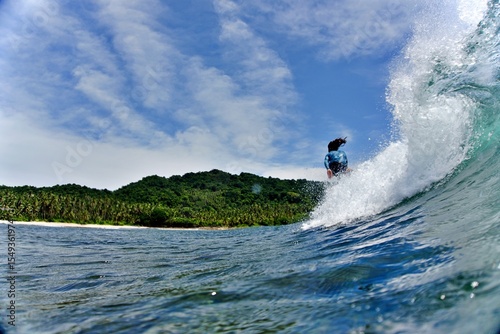 Fototapeta Naklejka Na Ścianę i Meble -  surfing the wave siargao ph