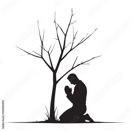 Silhouette of a Praying Man Kneeling Beside a Bare Tree in Winter