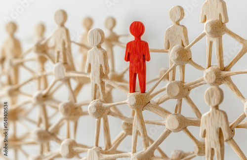 Red figure stands out amidst a network of people