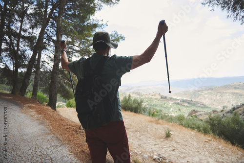Outdoor Adventure Featuring a Hiker Enjoying Scenic Mountain Views