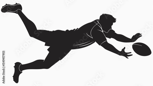 Silhouette of rugby player diving to catch the ball during a game with outstretched arms and legs