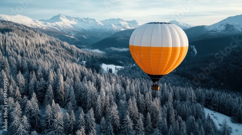 A serene hot air balloon floats gracefully above a beautiful winter landscape, surrounded by mountains and dense evergreen forests, showcasing nature's tranquil beauty.