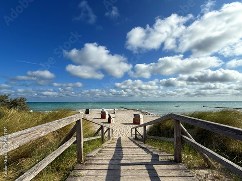 Summer Beach Access with Wooden Planks through the dunes and Strandkorb at the Baltic Sea