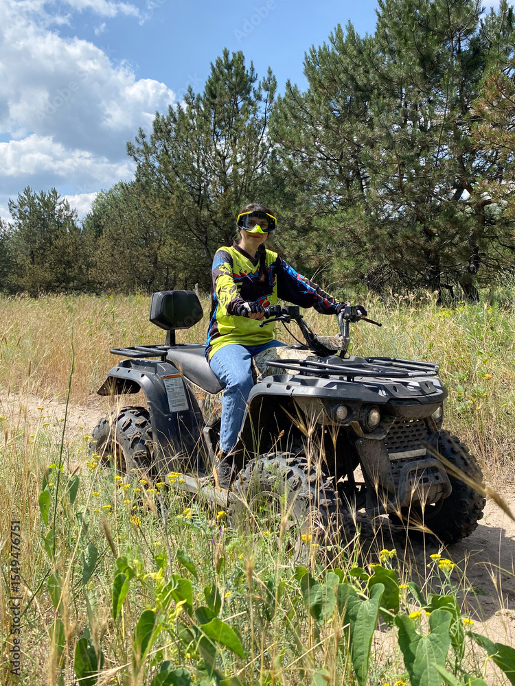 Quad bike ride on dirt roads in nature, vertical shooting Quad bike ride on dirt roads in nature, vertical shooting