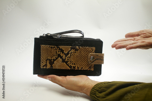 hand holding a suitcase
