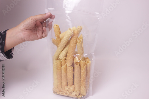 hand holding stick biscuits