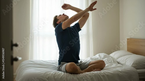 Inner Peace Morning Ritual: A person meditates gracefully, arms stretched upward in a moment of reflection, as light streams through the window, illustrating a tranquil start to the day.