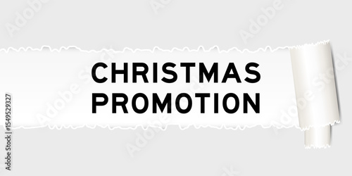 Ripped gray paper background that have word christmas promotion under torn part