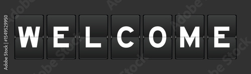 Black color analog flip board with word welcome on gray background