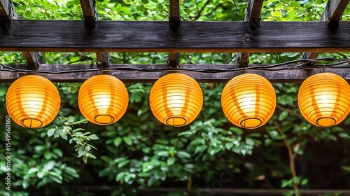 Classic Japanese roof lined with evenly spaced paper lanterns emitting warm light during twilight