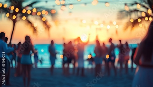Blurred beach party at sunset