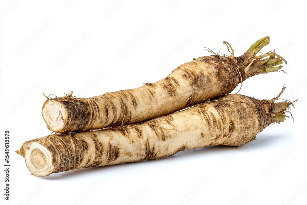 Obraz premium Horseradish roots displayed on a white backdrop