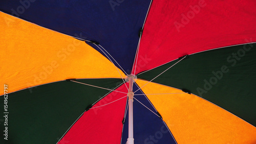 Closeup view of an opened colorful umbrella	
