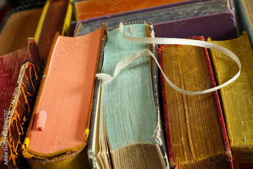 Close up of  multicolored vintage books, shallow depth of field.