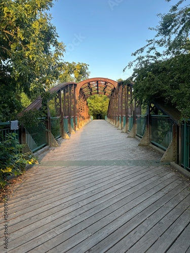wooden bridge with old rusty arches