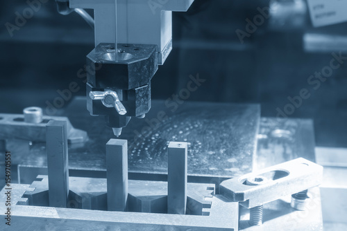 Operation of super drill EDM machine in the light blue scene.