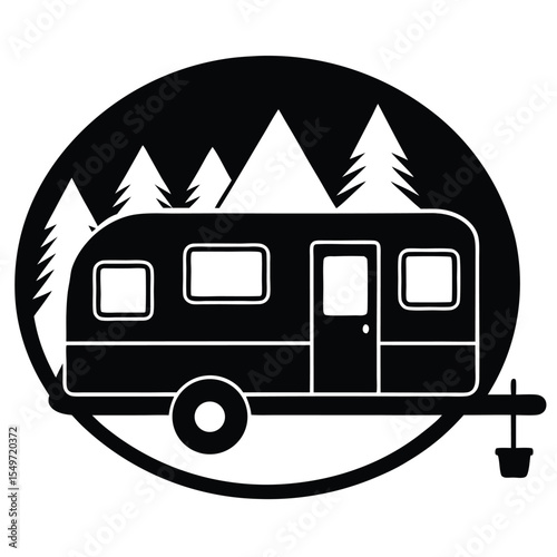 Retro travel trailer camping in front of pine trees and mountains