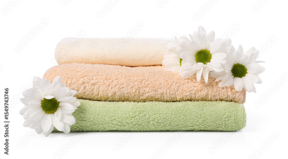 Soft towels and chrysanthemum flowers isolated on white Soft towels and chrysanthemum flowers isolated on white