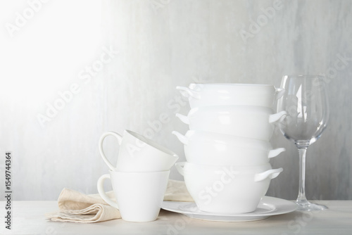 Wallpaper Mural Different clean dishware on light wooden table indoors Torontodigital.ca