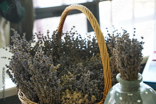 Dried lavender bouquet in a woven basket. Rustic floral arrangement for home decor, aromatherapy, and countryside vibes. Natural, eco-friendly, vintage-style composition.