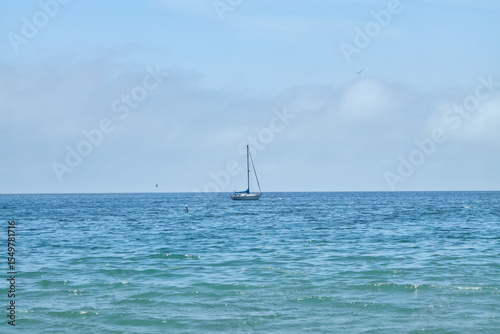 Sailboats on Blue Ocean with Cloudy Sky
