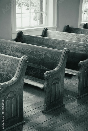 Foto Vintage wooden church pews in a serene.