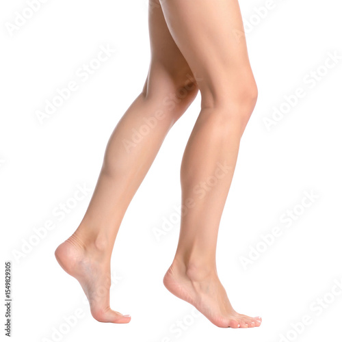 A pair of smooth, slender human legs and feet captured mid-step, showcasing natural skin texture and elegant posture.
