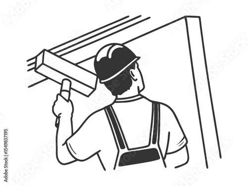A man working in uniform plastering the wall indoors