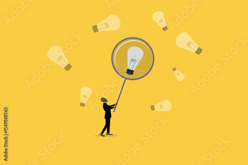 Businessman with Magnifying glass looking idea lightbulb, concept of startup idea and problem solving