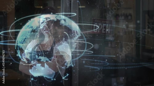 Shop owner opening glass door and initiating digital globe rotation for tech demonstration