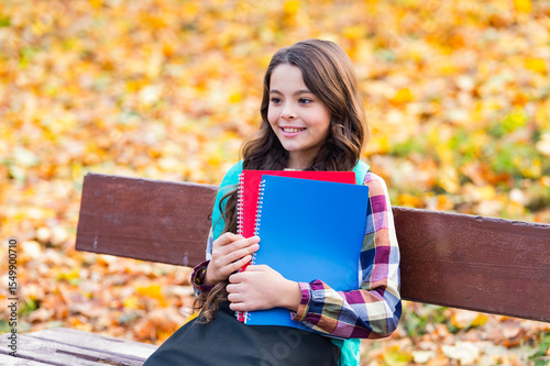 School education. Student girl do homework in autumn. Autumn time to study. School girl get knowledge outdoor. Knowledge day. Autumn day. Back to school. Education and knowledge. Open day