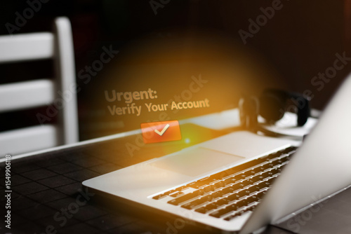 Cybersecurity threat: A laptop displays urgent notifications for account verification, a clear sign of a phishing scam and fake messages in the inbox