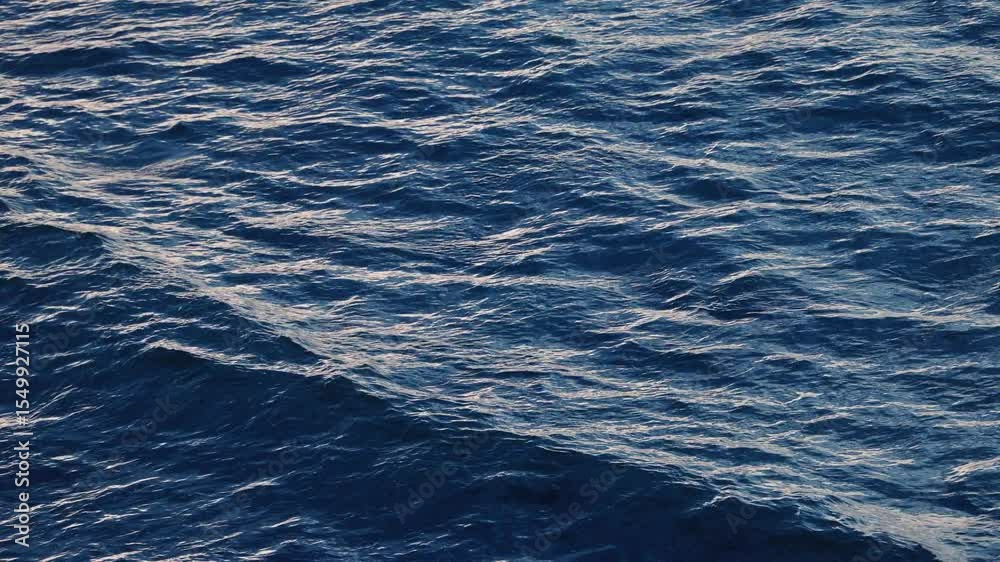 Blue crystal clear water. Perfect seascape in slow motion. Sea wave low angle view. Ocean surface, deep blue water color and waves. Blue waves sea water. Blue crystal clear water. Perfect seascape in slow motion. Sea wave low angle view. Ocean surface, deep blue water color and waves. Blue waves sea water.