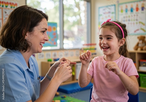 A speech therapist helps a young girl improve her communication skills in a supportive classroom environment.