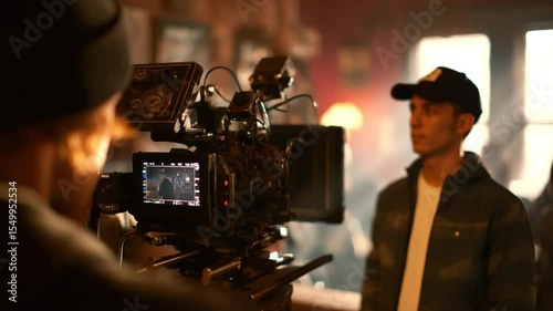 Professional Camera Setup Behind the Scenes in a Cinematic Environment with Crew