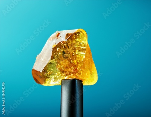 live rosin on a dab tool with a blue background