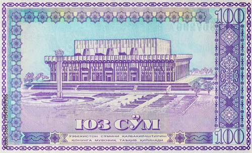 100 sum banknote of Uzbekistan with the image of Friendship of Nations Square in Tashkent, fragment for design. paper money of Uzbekistan.
