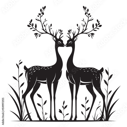 Elegant black silhouette of two deer with leafy antlers touching noses in a meadow