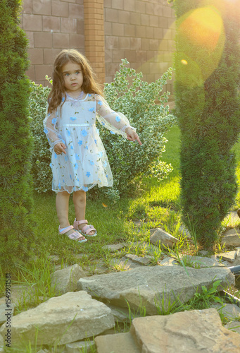child in nature near water