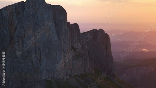 Drone view of Bolshoy Tkhach rocky mount in Caucasus with sunset or sunrise light