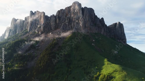 Natural park Bolshoy Tkhach mount with fog and evening sunlight. The Caucasus Mountains.