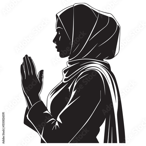 Silhouette of a muslim woman wearing a hijab praying with her hands together