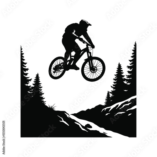 Dynamic silhouette of a mountain biker soaring through the air