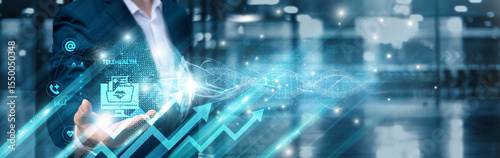 Businessman holding telehealth innovation icon and integrated digital global network, remote diagnostics, patient empowerment, virtual care delivery, health data analytics, secure connectivity